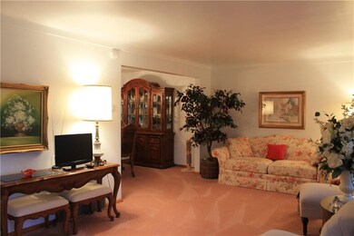 Living room view showing flow to dining room.