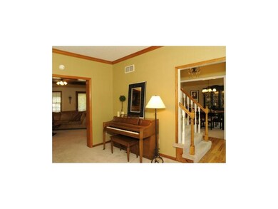 Living room open to the great room and entry updat