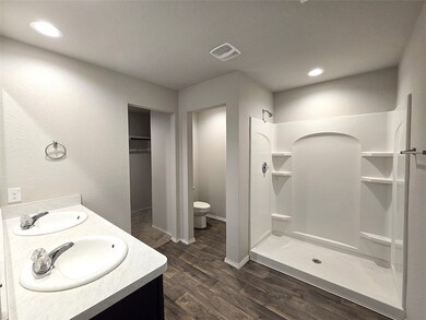 Luxurious master bathroom featuring a double vanit