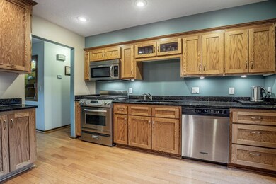Kitchen with stainless steel appliances, and reces