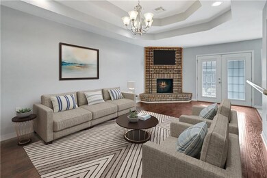 Cozy Den with Fireplace and Trey Ceiling