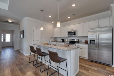 Kitchen featuring white cabinets, visible vents, s