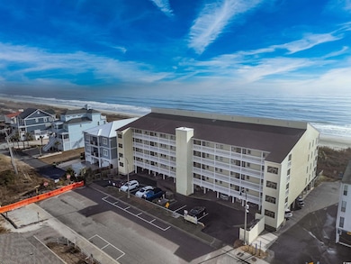 Birds eye view of property with a beach view