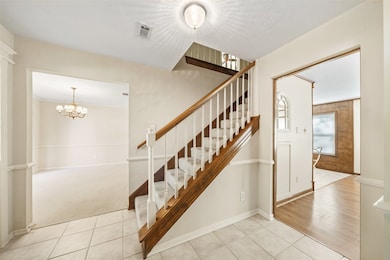 Staircase up to 4 bedrooms upstairs