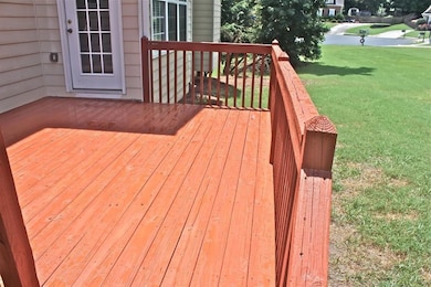 Deck featuring a yard