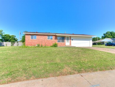Ranch-style house with a garage and a front yard