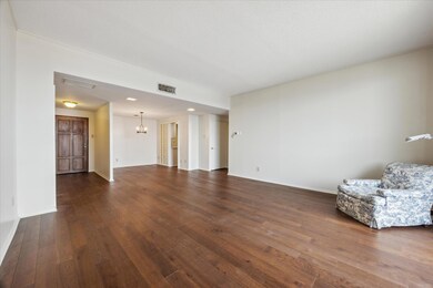 Unfurnished living room featuring dark wood finis