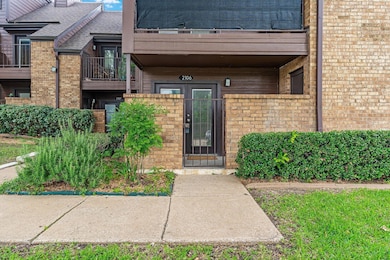 Property entrance with brick siding and roof with 