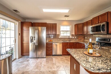 Kitchen with Granite countertop & SS Appliance