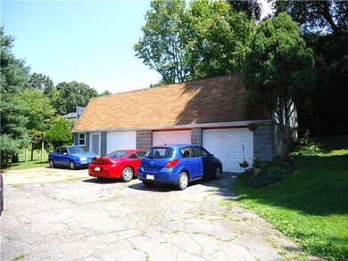 Parking Lot/Garage. Detached 3 car garage with pot
