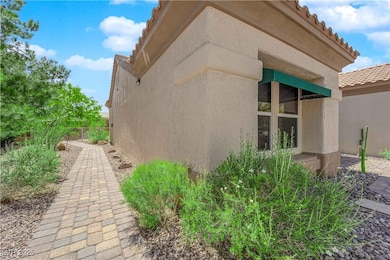View of side of property with stucco siding, fence