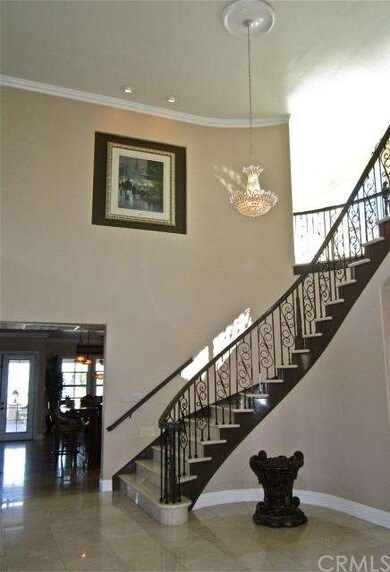 Curved wrought iron staircase.