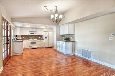 Kitchen with double doors leading to the spacious 