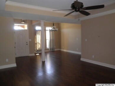 Looking back you can see the foyer and the dining room, also with the updated flooring, smooth ceilings, and crown moldings.