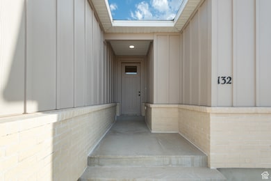 Entrance to property featuring board and batten siding