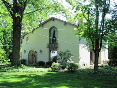 balconies and porticos adorn this beautiful home