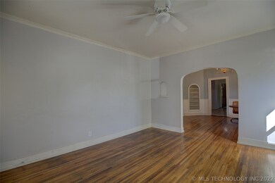  Open to dining with an oversized arched pass thro