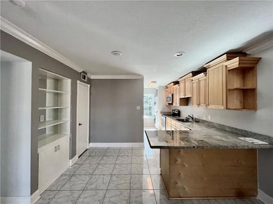 Kitchen with Shelves, cabinets and closet on the l