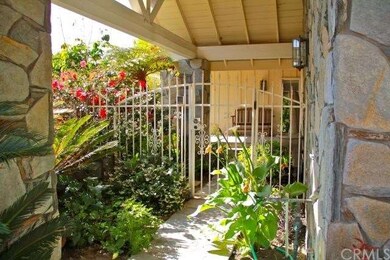 Garden of Eden entry through a gated courtyard in 