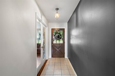 Entry has ceramic tile, study with french doors.