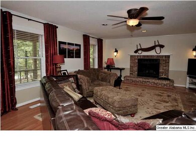 Oversized family room with cozy wood burning firep