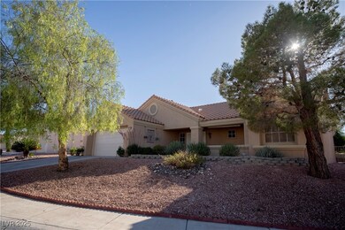 View of front of home with stucco siding, driveway