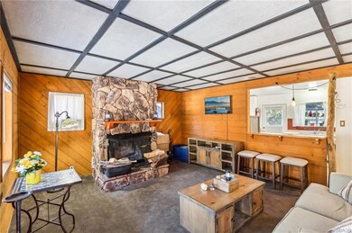 LIVING ROOM HAS BEAUTIFUL ROCK FIREPLACE, NEWER CA
