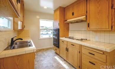 Bright kitchen with ample counter space and cabine