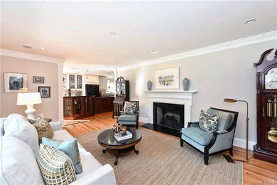 Formal Living Room with fireplace and leading righ