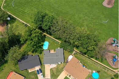 Drone shot of lot (house is lighter gray roof with