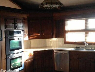 Open Kitchen with Jenn Air stainless double ovens.