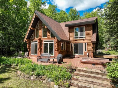 Back of house featuring a deck