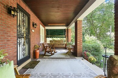 Relax on the 28x10 covered front porch - take a na