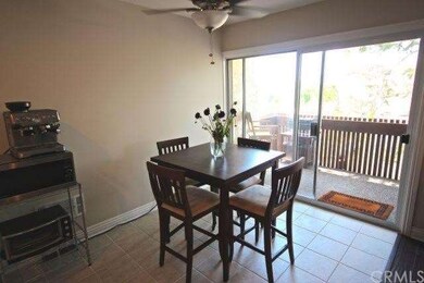 Dining area opens to private balcony.