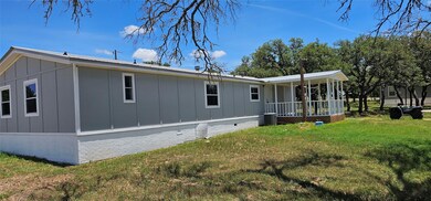 Rear view of property featuring board and batten 