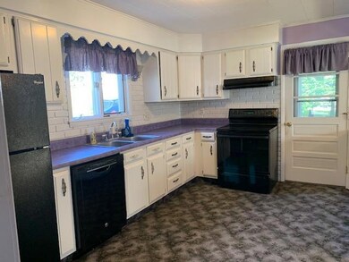 Cheerful Kitchen looks out to parking pad