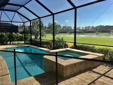 Swimming pool featuring a water view, an in-ground