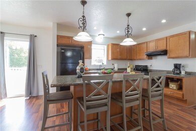 A view of the delightful kitchen with maple cabine