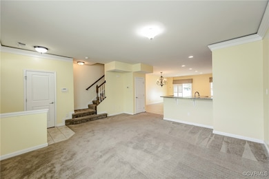 Unfurnished living room with a chandelier, light c