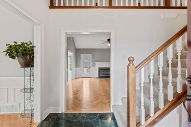 Interior space with ceiling fan, a fireplace, and 