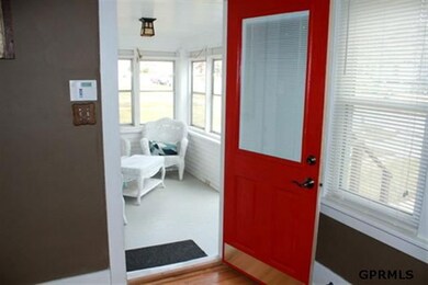 This lovely enclosed porch welcomes you & your guests to your beautiful, updated home!  Enjoy reading a book while sipping coffee or wine, alone or with a friend!