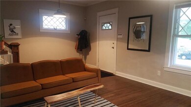 Another living room view, toward front door