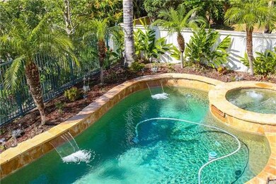 Sparkling Pebble Tech pool with multiple waterfall