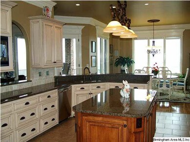Formal dining room with coffered ceiling, chandeli