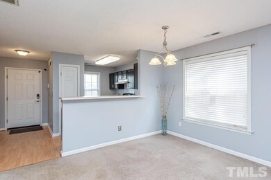 Open floor plan leads from Kitchen into Dining Are