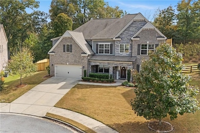 Craftsman-style home with covered porch, stone siding, driveway, a garage, and roof with shingles