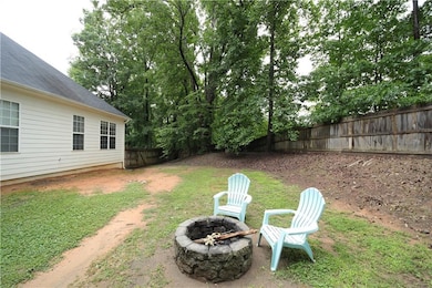 View of yard featuring a fire pit