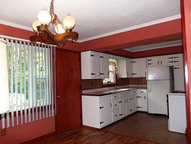 Kitchen. Newer tile floor. Door leads to rear deck