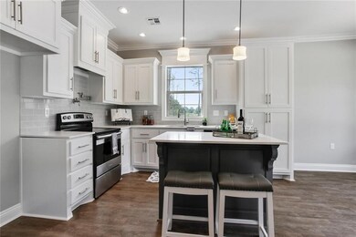 Kitchen with stainless appliances, bar, dishwasher