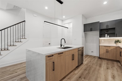 Architectural clarity shines
through the open stair railings
and clean sightlines, connecting
each level in one cohesive
design language.